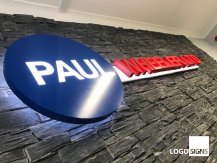 Paul Wheeler metal logo sign